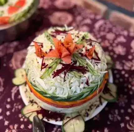 vegetable salad with a flower garnish.