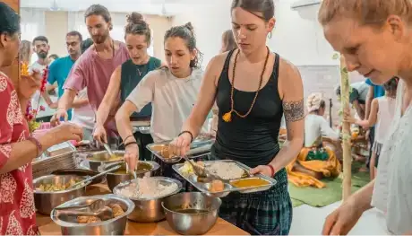 Student selecting dishes from a buffet