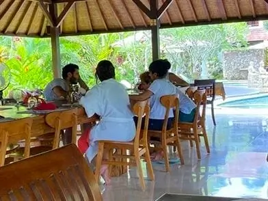 Guests sharing a plant-based meal in the open dining hall
