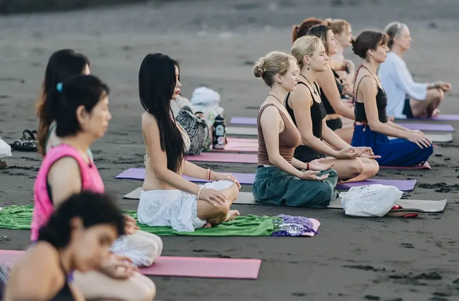 An outdoor group meditation in Ubud, Bali