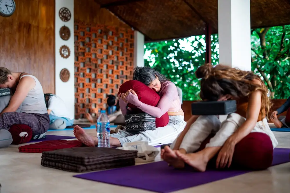 Yin yoga class with props and bolsters at Bali Yoga Retreats school in Ubud