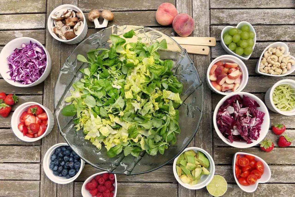 Fresh salad with fruits, veggies, and green Fresh salad with fruits, veggies, and green
