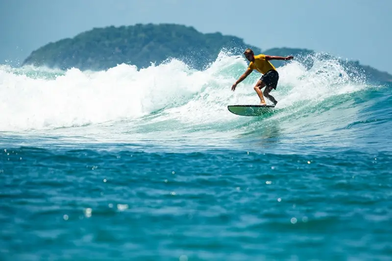 Surfer riding a wave in Bali during October