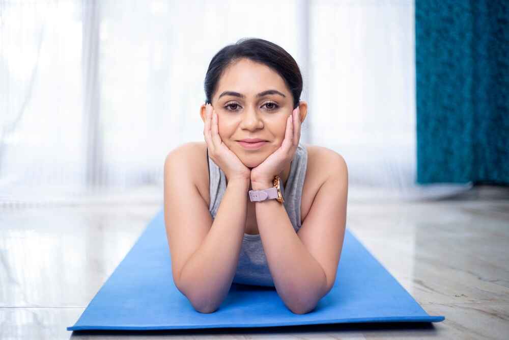 A Woman Practising Makarasana