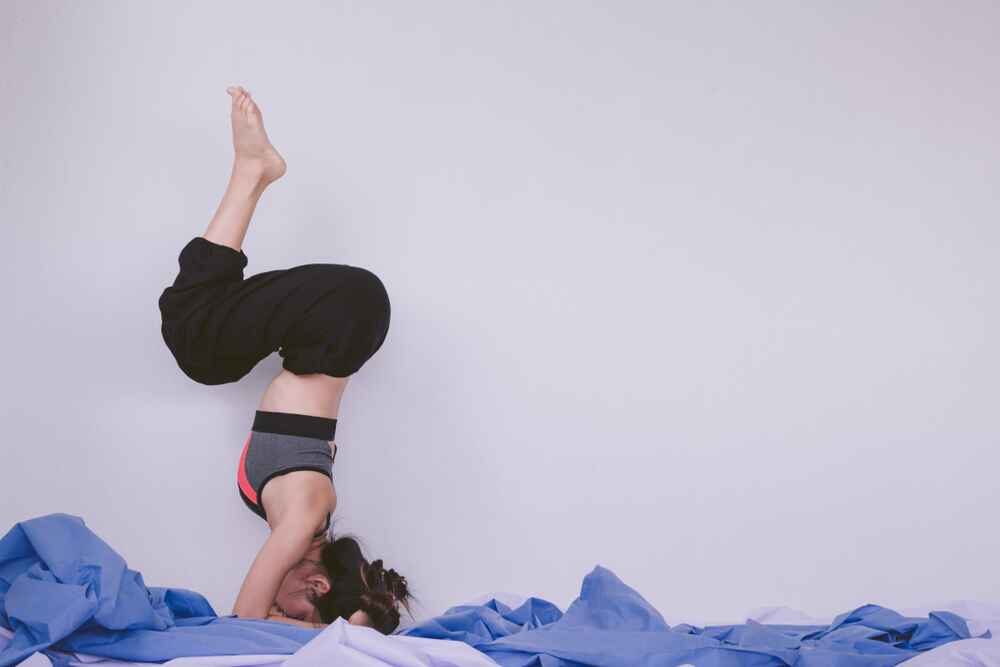 Woman in Egg shape Yoga Pose Woman in Egg shape Yoga Pose