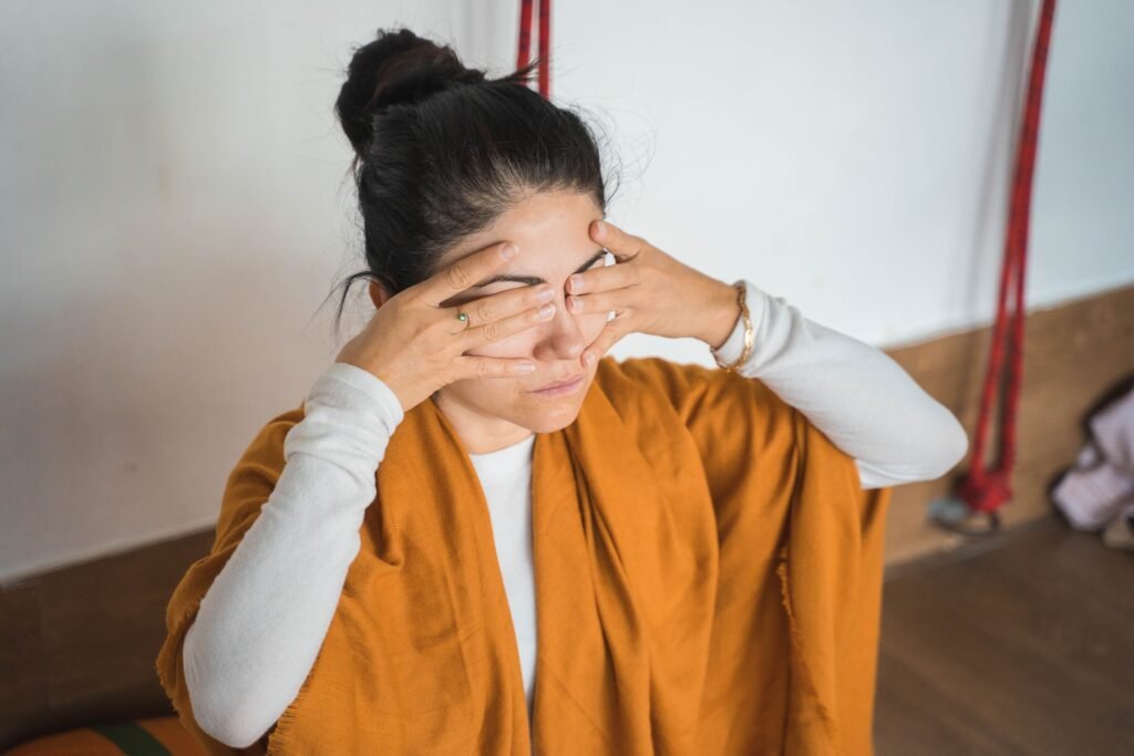 A Woman Practicing Bhramari Pranayama A Woman Practicing Bhramari Pranayama