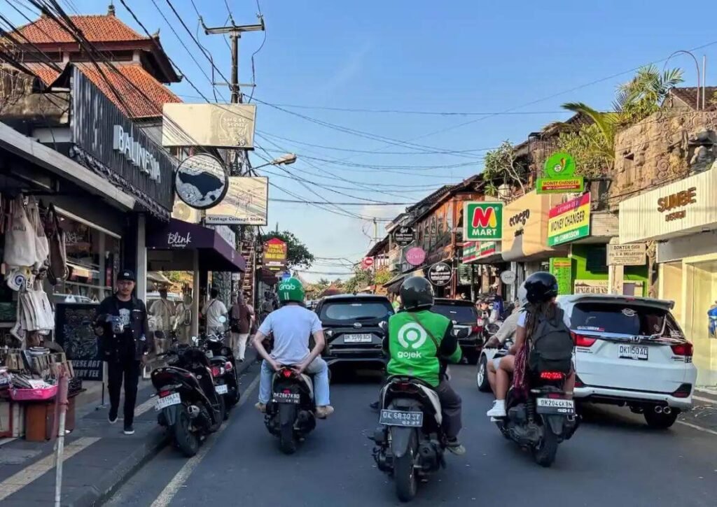 Busy Bali street with scooters and traffic
