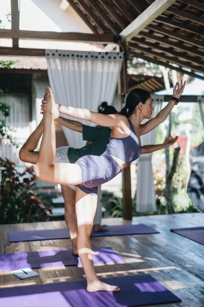 Women Practicing Yoga During Their Class